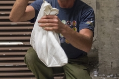 Jeremy Gates weighing peregrine chick